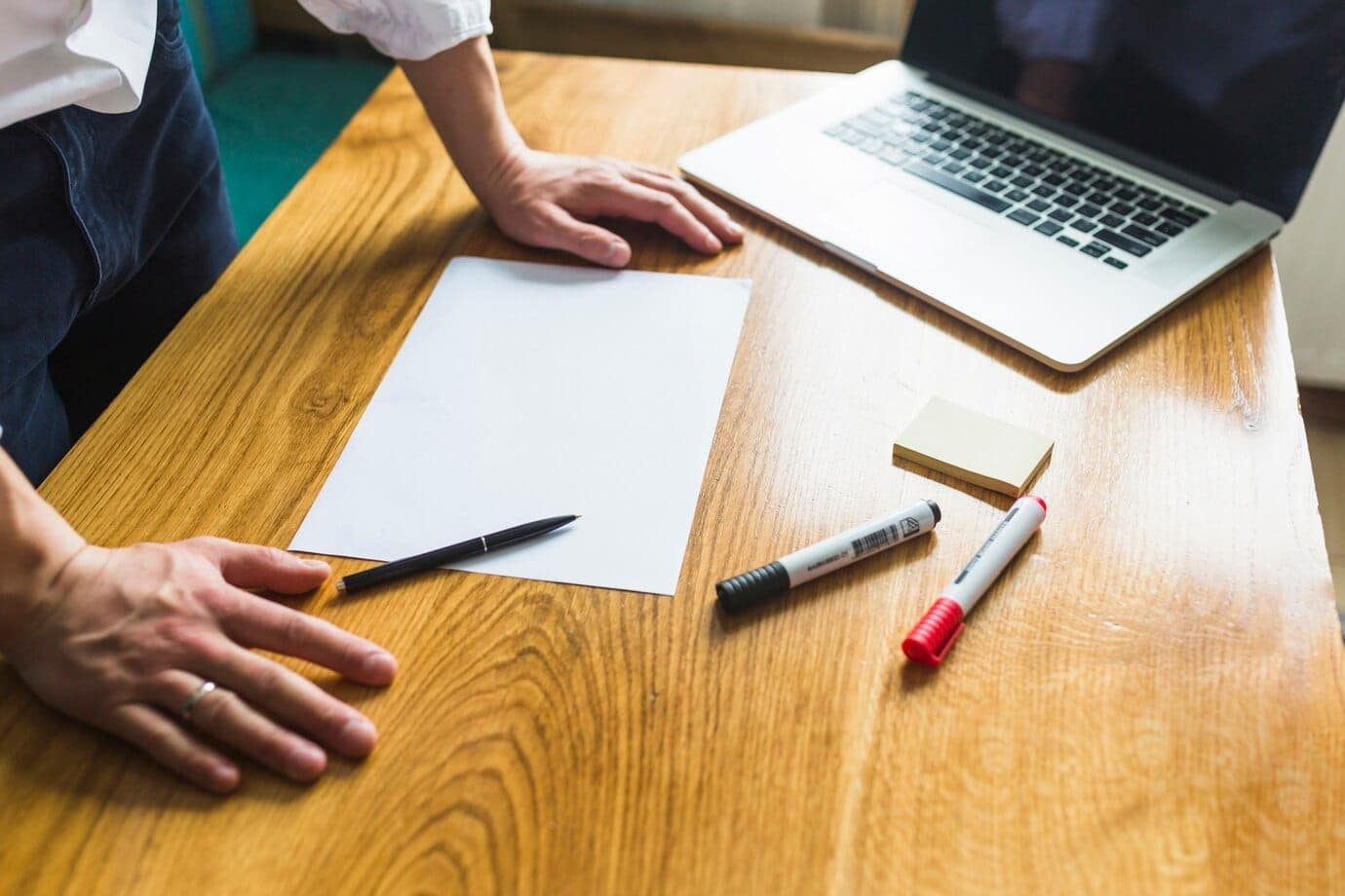 How to start probate in Oklahoma. 7 businessperson s hand with blank white paper wooden desk 23 2147838598