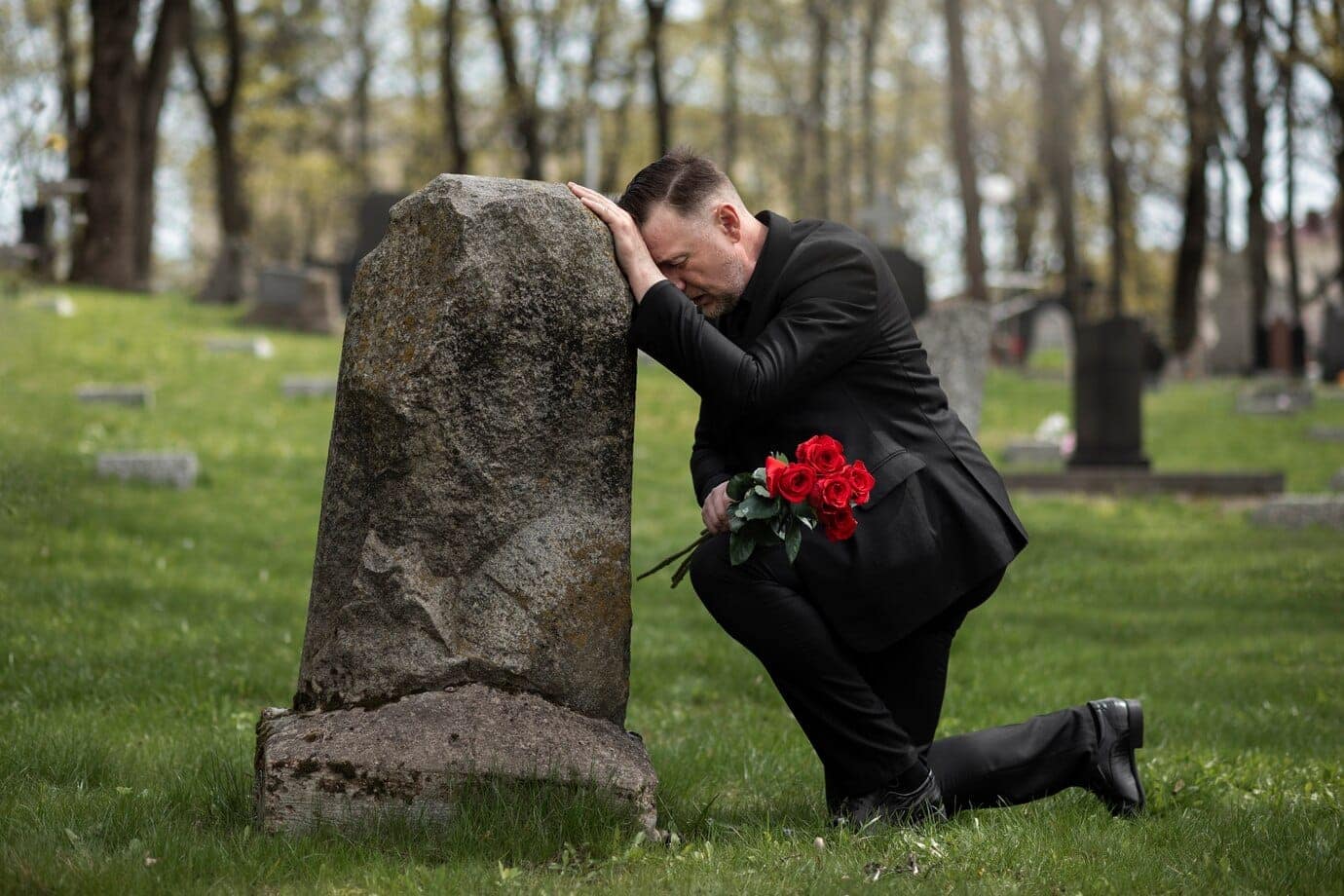 How do you get a death certificate in Delaware? 7 man bringing roses gravestone cemetery 23 2149431248