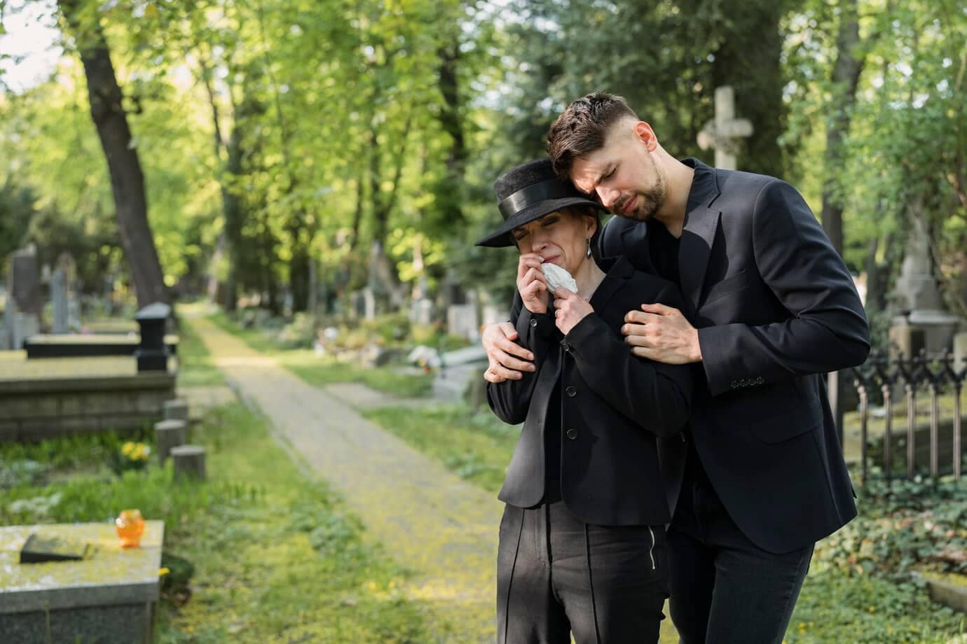 How do you get a death certificate in Mississippi? 7 mourning woman cemetery being consoled by man 23 2149435457