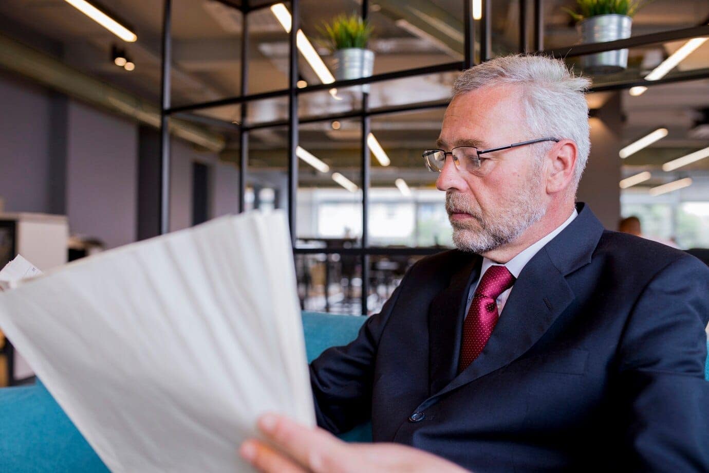 Do wills need to be filed with a government entity in Mississippi? 7 senior businessman sitting reading newspaper office 23 2147923321