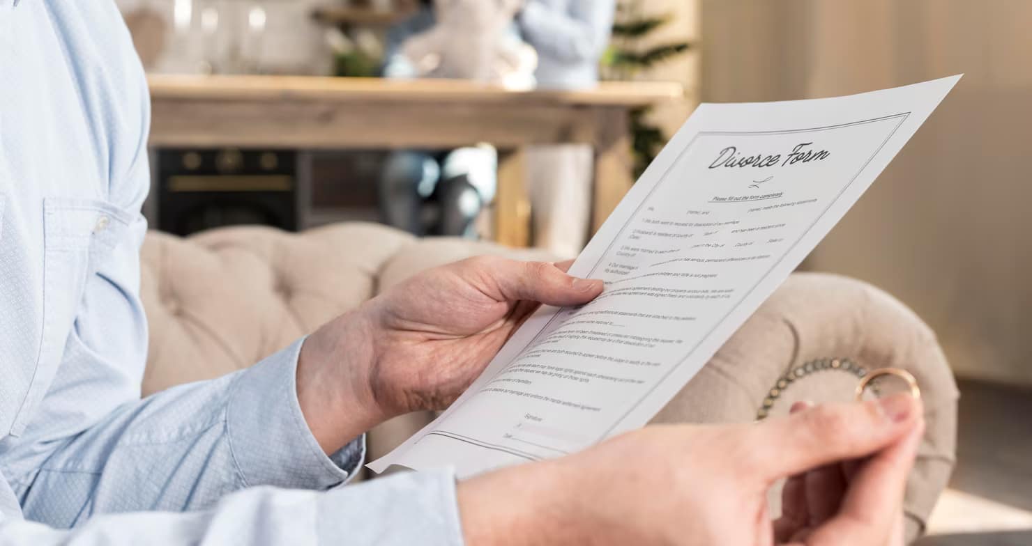 How do you get a death certificate in Wyoming? 7 close up male reading divorce form 23 2148548563 2
