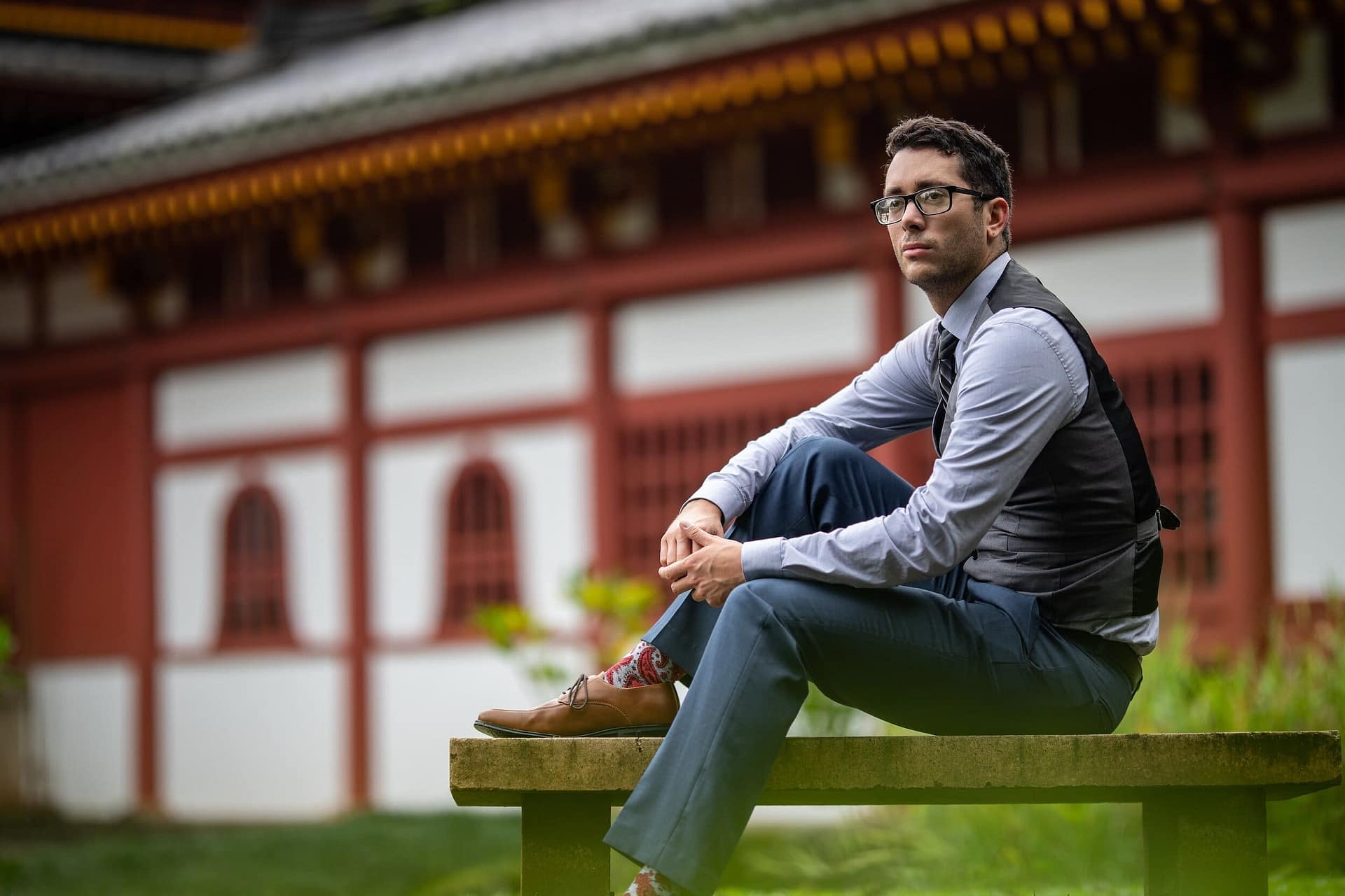 Funeral Prep 101: Making Tough Choices Easier for Your Loved Ones 3 A man sitting on a bench outside a temple