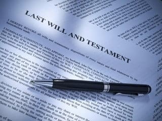 What Are Pour-Over Wills? And How Do They Work? 3 A printed Last Will and Testament document with a pen